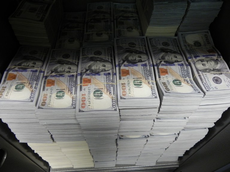 At one location during Wednesday’s takedown in Los Angeles, FBI agents seized nearly $3 million in cash.