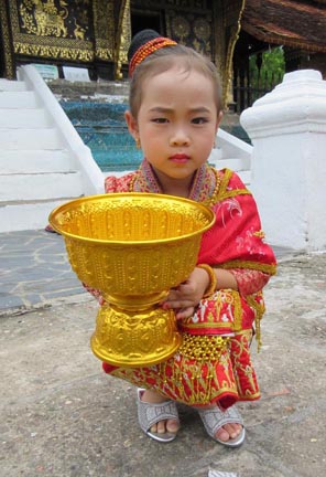Little girl at Wat Xieng Thong Temple. Photograph © Mark Ulyseas