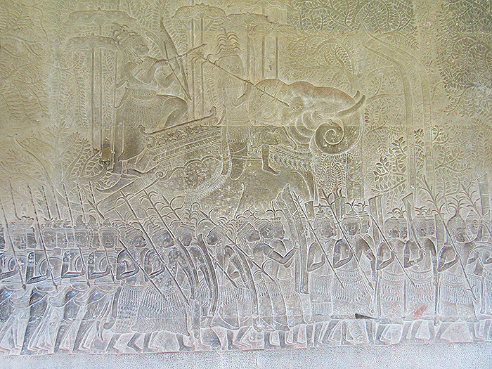 Stone base relief depicting a scene from the Hindu epic, Mahabharata, Angkor Wat, Siem Reap, Cambodia. Photograph by Mark Ulyseas.