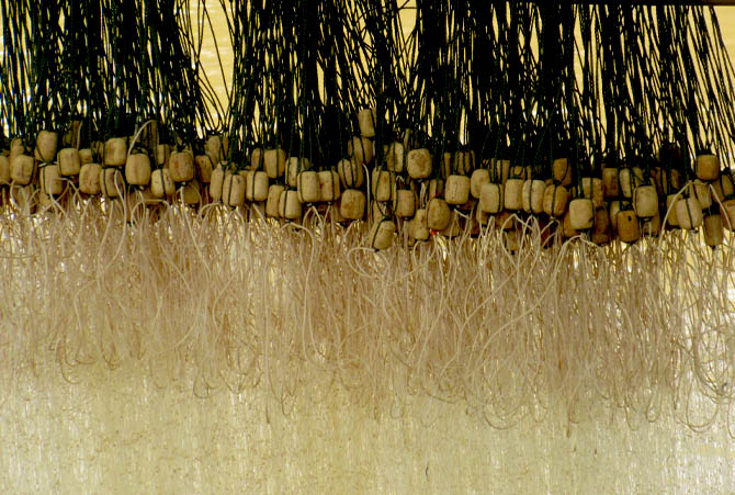 Fishnets hanging on a riverbank. Photograph by Mark Ulyseas
